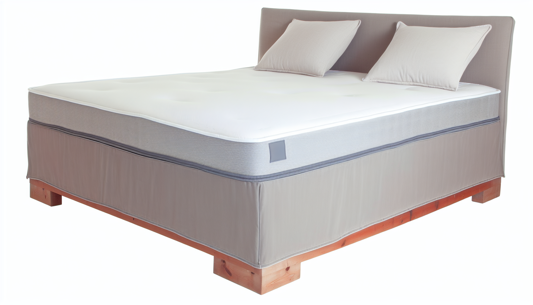 Ein Boxspringbett, traditionell bekannt fÃ¼r sein zweigeteiltes Design. Der untere Teil besteht aus einem stabilen Holzrahmen, der mit Stoff bezogen ist und die Federkerne beherbergt. Der obere Teil ist eine bequeme Matratze, die zum Schlafen gedacht ist. Das gesamte Objekt ist normalerweise mit einem weichen, strapazierfÃ¤higen Stoff bezogen â€“ typischerweise in einer neutralen Farbe wie Grau oder Beige. Das Bett steht deutlich hoch vom Boden, oft begleitet von einer geschmackvoll ausgewÃ¤hlten Bettdecke und einigen passenden oder kontrastierenden Dekorationskissen.